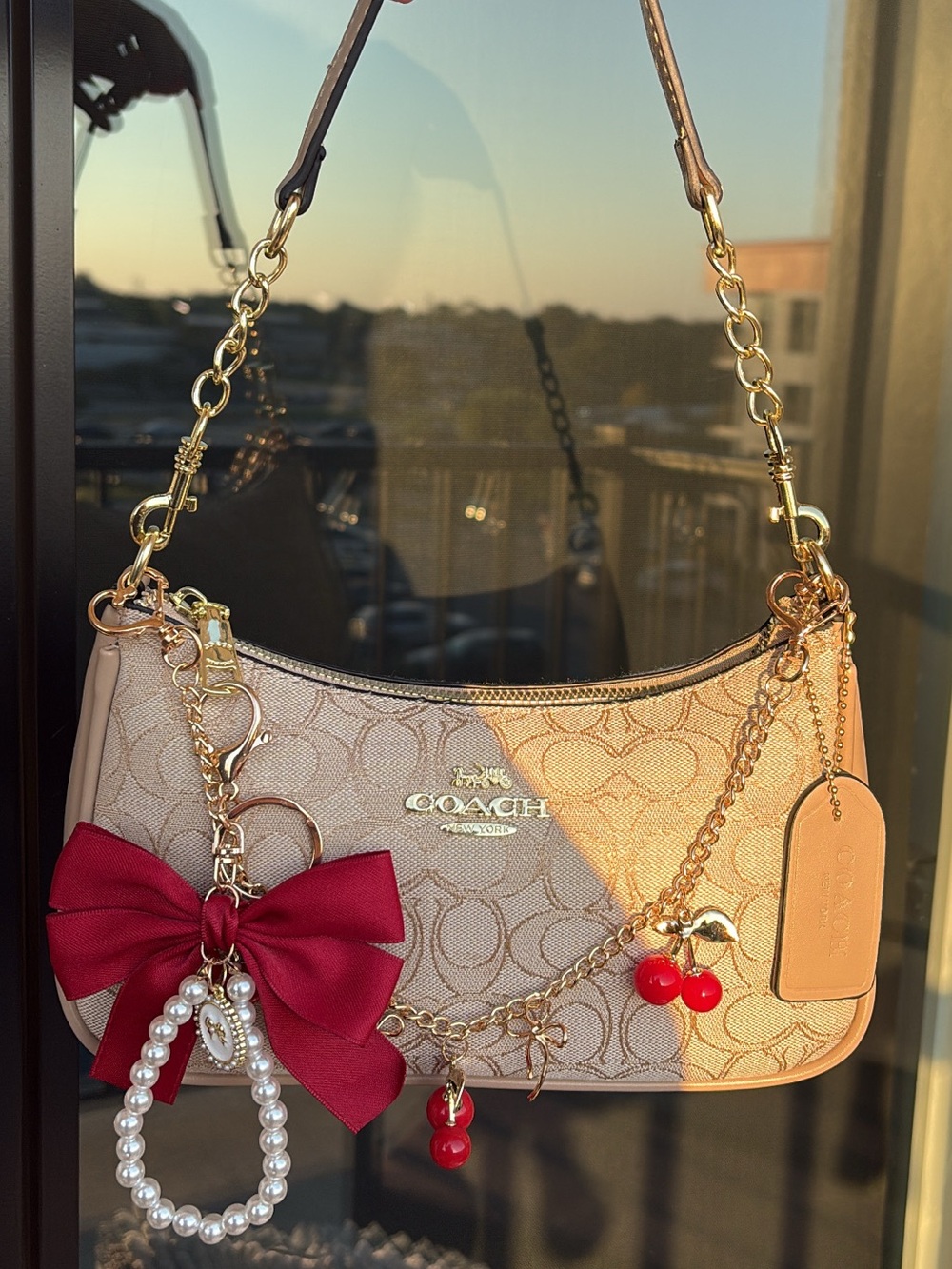 Coach Beige Signature Shoulder Bag with Red Bow and Cherry Charms